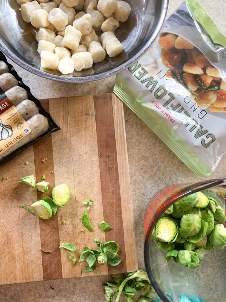 sheet pan cauliflower gnocchi, brussels sprouts and chicken sausage ingredients flat lay