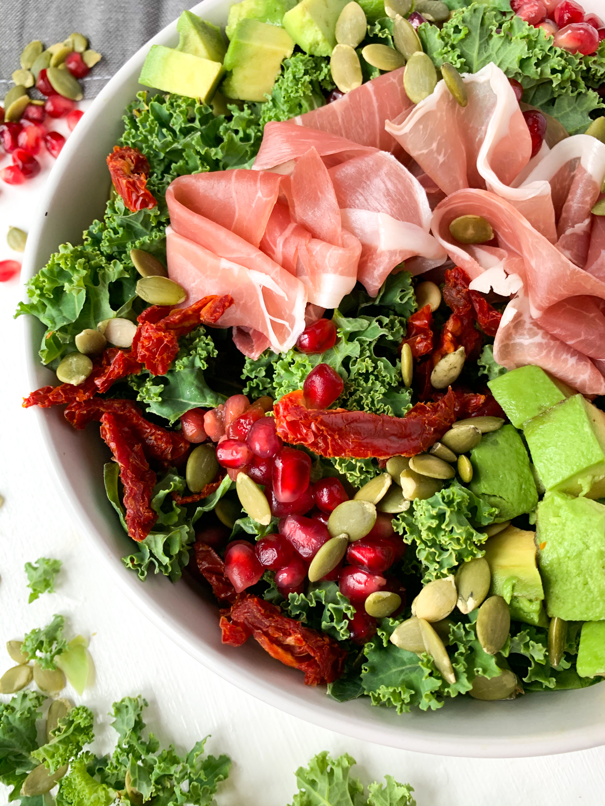 prosciutto and pomegranate kale salad